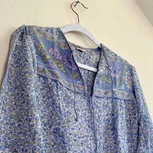 Vintage India Shirt In Featherweight Sheer Cotton Gauze With Pale Floral Print + Ethereal Balloon Sleeves | Deadstock. never been worn vintage Indian peasant blouse in pastel blues and violets. vintage Indian blouse. deadstock vintage India top. sheer cotton gauze India blouse. balloon sleeve India shirt. featherweight Indian gauze blouse. rare deadstock vintage India blouses. hand printed cotton Indian shirts.