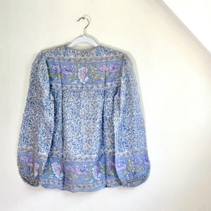 Vintage India Shirt In Featherweight Sheer Cotton Gauze With Pale Floral Print + Ethereal Balloon Sleeves | Deadstock. never been worn vintage Indian peasant blouse in pastel blues and violets. vintage Indian blouse. deadstock vintage India top. sheer cotton gauze India blouse. balloon sleeve India shirt. featherweight Indian gauze blouse. rare deadstock vintage India blouses. hand printed cotton Indian shirts.