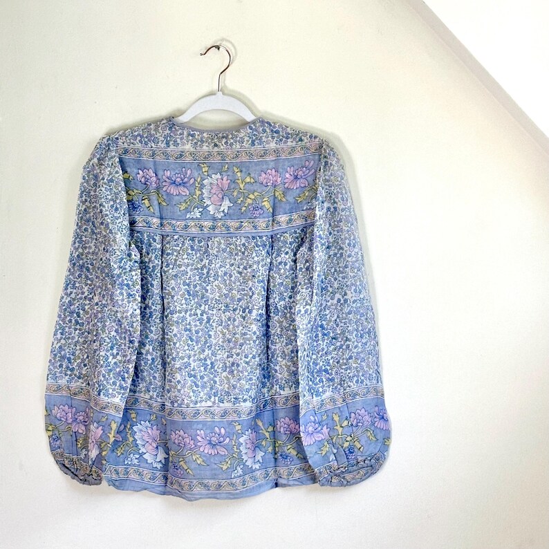 Vintage India Shirt In Featherweight Sheer Cotton Gauze With Pale Floral Print + Ethereal Balloon Sleeves | Deadstock. never been worn vintage Indian peasant blouse in pastel blues and violets. vintage Indian blouse. deadstock vintage India top. sheer cotton gauze India blouse. balloon sleeve India shirt. featherweight Indian gauze blouse. rare deadstock vintage India blouses. hand printed cotton Indian shirts.