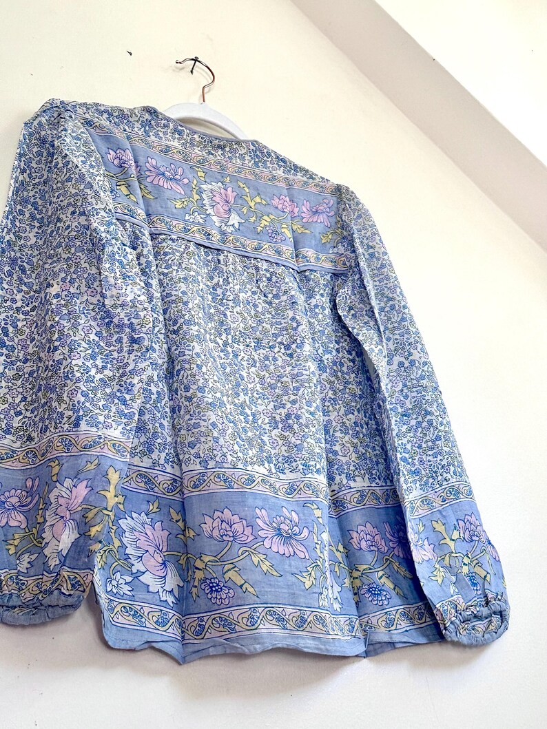Vintage India Shirt In Featherweight Sheer Cotton Gauze With Pale Floral Print + Ethereal Balloon Sleeves | Deadstock. never been worn vintage Indian peasant blouse in pastel blues and violets. vintage Indian blouse. deadstock vintage India top. sheer cotton gauze India blouse. balloon sleeve India shirt. featherweight Indian gauze blouse. rare deadstock vintage India blouses. hand printed cotton Indian shirts.