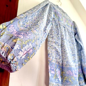 Vintage India Shirt In Featherweight Sheer Cotton Gauze With Pale Floral Print + Ethereal Balloon Sleeves | Deadstock. never been worn vintage Indian peasant blouse in pastel blues and violets. vintage Indian blouse. deadstock vintage India top. sheer cotton gauze India blouse. balloon sleeve India shirt. featherweight Indian gauze blouse. rare deadstock vintage India blouses. hand printed cotton Indian shirts.