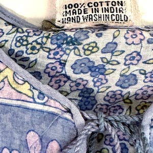 Vintage India Shirt In Featherweight Sheer Cotton Gauze With Pale Floral Print + Ethereal Balloon Sleeves | Deadstock. never been worn vintage Indian peasant blouse in pastel blues and violets. vintage Indian blouse. deadstock vintage India top. sheer cotton gauze India blouse. balloon sleeve India shirt. featherweight Indian gauze blouse. rare deadstock vintage India blouses. hand printed cotton Indian shirts.