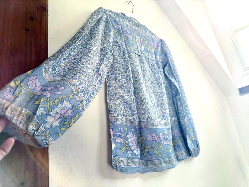 Vintage India Shirt In Featherweight Sheer Cotton Gauze With Pale Floral Print + Ethereal Balloon Sleeves | Deadstock. never been worn vintage Indian peasant blouse in pastel blues and violets. vintage Indian blouse. deadstock vintage India top. sheer cotton gauze India blouse. balloon sleeve India shirt. featherweight Indian gauze blouse. rare deadstock vintage India blouses. hand printed cotton Indian shirts.