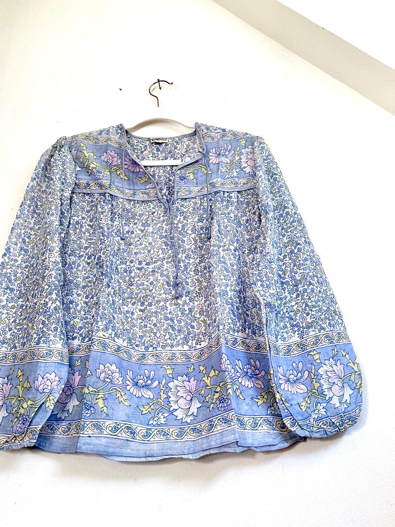 Vintage India Shirt In Featherweight Sheer Cotton Gauze With Pale Floral Print + Ethereal Balloon Sleeves | Deadstock. never been worn vintage Indian peasant blouse in pastel blues and violets. vintage Indian blouse. deadstock vintage India top. sheer cotton gauze India blouse. balloon sleeve India shirt. featherweight Indian gauze blouse. rare deadstock vintage India blouses. hand printed cotton Indian shirts.