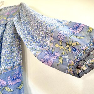 Vintage India Shirt In Featherweight Sheer Cotton Gauze With Pale Floral Print + Ethereal Balloon Sleeves | Deadstock. never been worn vintage Indian peasant blouse in pastel blues and violets. vintage Indian blouse. deadstock vintage India top. sheer cotton gauze India blouse. balloon sleeve India shirt. featherweight Indian gauze blouse. rare deadstock vintage India blouses. hand printed cotton Indian shirts.