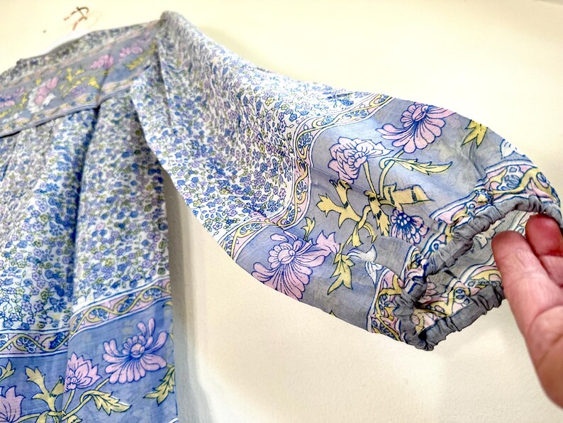 Vintage India Shirt In Featherweight Sheer Cotton Gauze With Pale Floral Print + Ethereal Balloon Sleeves | Deadstock. never been worn vintage Indian peasant blouse in pastel blues and violets. vintage Indian blouse. deadstock vintage India top. sheer cotton gauze India blouse. balloon sleeve India shirt. featherweight Indian gauze blouse. rare deadstock vintage India blouses. hand printed cotton Indian shirts.