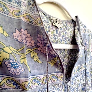 Vintage India Shirt In Featherweight Sheer Cotton Gauze With Pale Floral Print + Ethereal Balloon Sleeves | Deadstock. never been worn vintage Indian peasant blouse in pastel blues and violets. vintage Indian blouse. deadstock vintage India top. sheer cotton gauze India blouse. balloon sleeve India shirt. featherweight Indian gauze blouse. rare deadstock vintage India blouses. hand printed cotton Indian shirts.