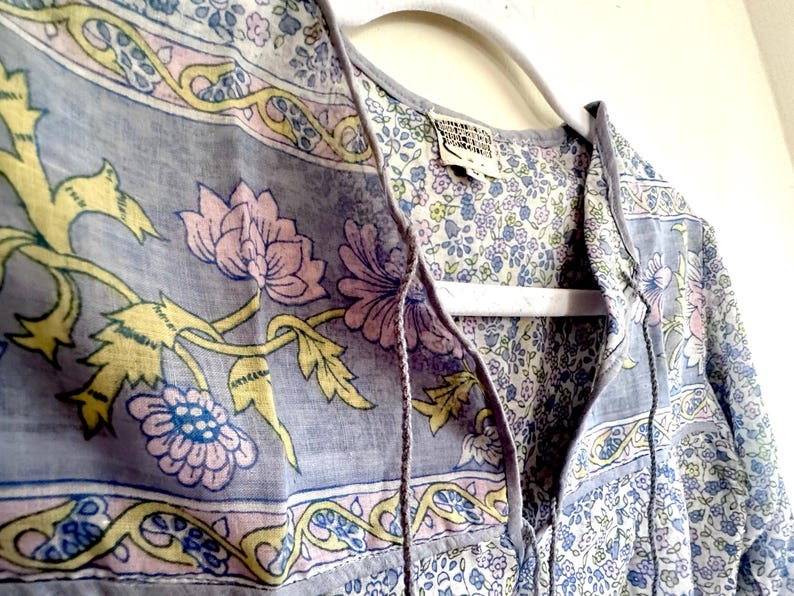Vintage India Shirt In Featherweight Sheer Cotton Gauze With Pale Floral Print + Ethereal Balloon Sleeves | Deadstock. never been worn vintage Indian peasant blouse in pastel blues and violets. vintage Indian blouse. deadstock vintage India top. sheer cotton gauze India blouse. balloon sleeve India shirt. featherweight Indian gauze blouse. rare deadstock vintage India blouses. hand printed cotton Indian shirts.