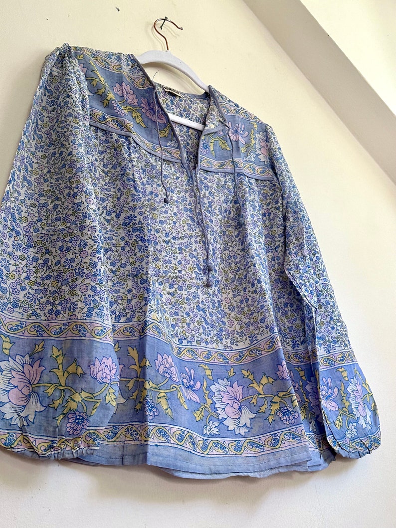 Vintage India Shirt In Featherweight Sheer Cotton Gauze With Pale Floral Print + Ethereal Balloon Sleeves | Deadstock. never been worn vintage Indian peasant blouse in pastel blues and violets. vintage Indian blouse. deadstock vintage India top. sheer cotton gauze India blouse. balloon sleeve India shirt. featherweight Indian gauze blouse. rare deadstock vintage India blouses. hand printed cotton Indian shirts.