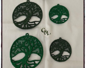 May include: Four green tree of life ornaments of varying sizes. The ornaments are made of a delicate lace-like material and feature a detailed tree design with intricate branches and roots.