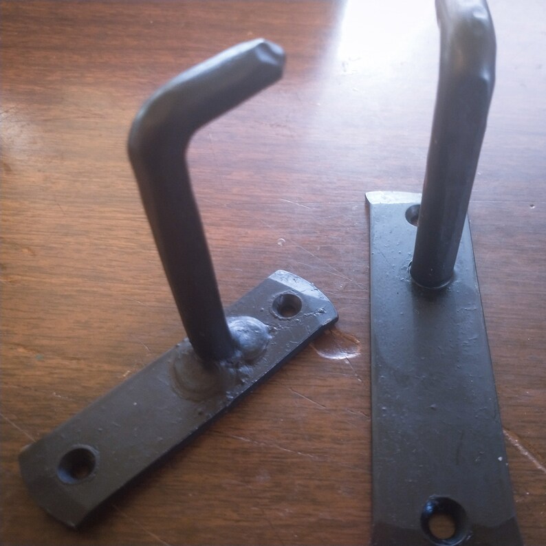 Mismatched pair of 2 in simple coat/pan hooks image 1