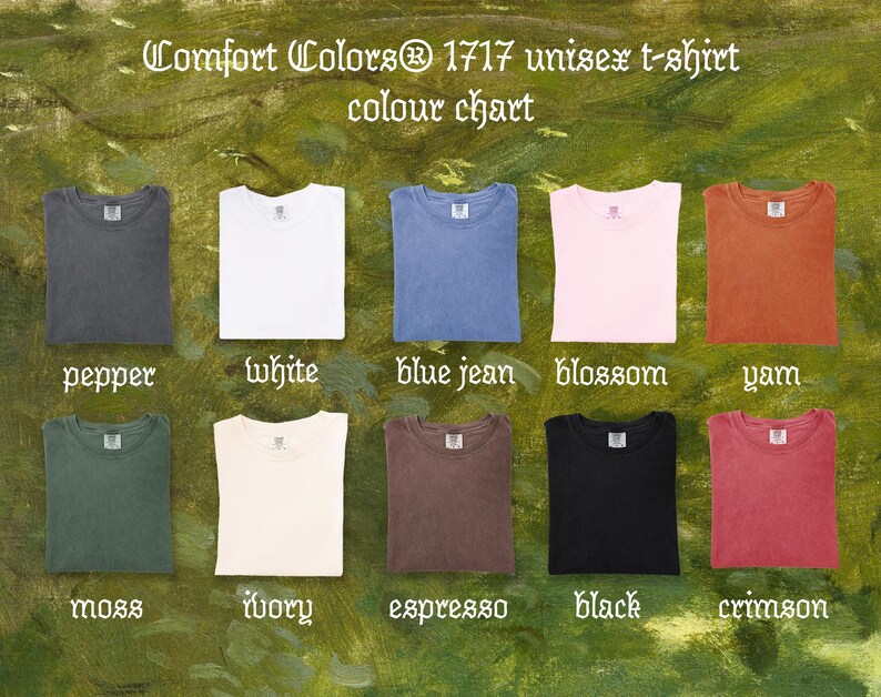 May include: Color chart of Comfort Colors 1717 unisex t-shirts. The chart displays folded t-shirts in various colors, including pepper, white, blue jean, blossom, yam, moss, ivory, espresso, black, and crimson. The text "Comfort Colors" is at the top.