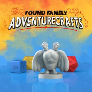 May include: A gray, cartoon-style moth figurine with large eyes and wings, standing on a circular base. The image includes a blue, yellow, and red die, and the text "FOUND FAMILY ADVENTURECRAFTS" in a playful font against a colorful background.
