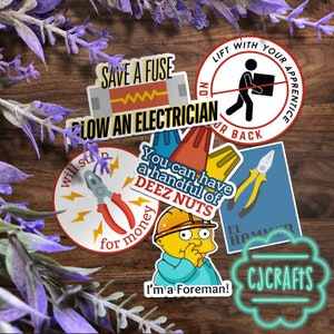 May include: A set of 8 electrician themed stickers with various sayings, including "Save a Fuse", "Blow an Electrician", "You can have a handful of Deez Nuts", "Will strip for money", "Lift with your apprentice, on your back", "El Hammer", and "I'm a Foreman!" The stickers are on a wooden background with purple flowers.