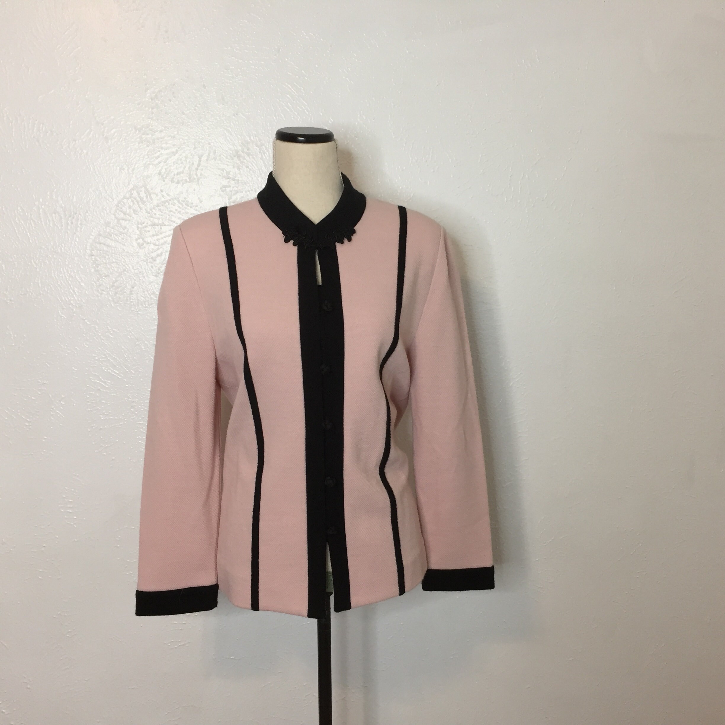 pink cardigan with black trim