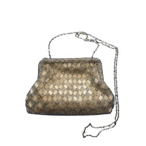 May include: A gold beaded evening bag with a chain strap. The bag has a geometric pattern and is made of small, shiny beads.