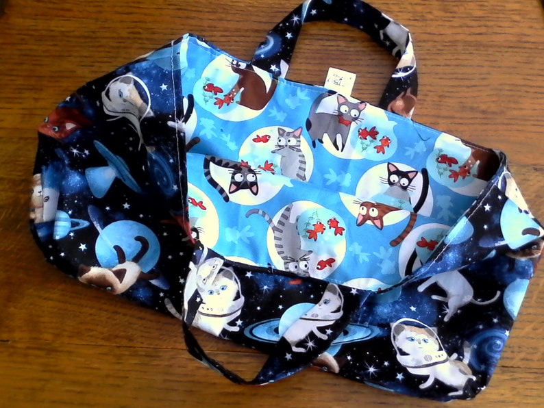 Fully reversible 100/% cotton bag with space cats one one side and the reverse side cats and goldfish