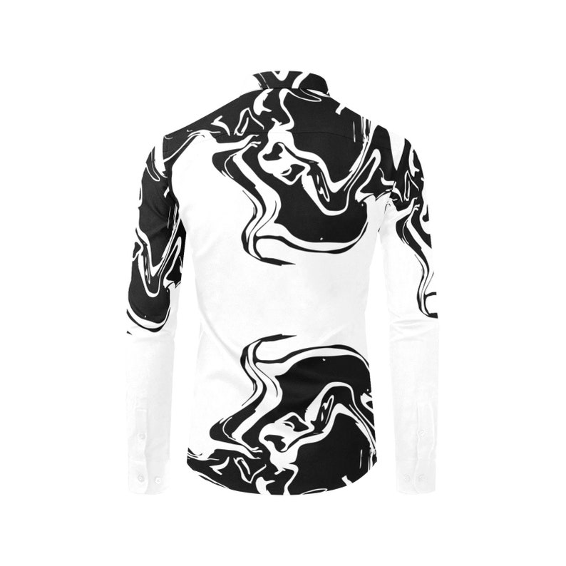 Puede incluir: Una camisa blanca de manga larga con botones y un patr&oacute;n abstracto de m&aacute;rmol negro.