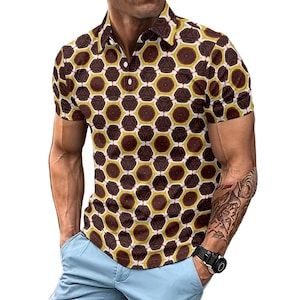 May include: A short-sleeved polo shirt featuring a repeating geometric pattern of dark brown and mustard yellow hexagons. The shirt has a classic collar, a buttoned placket with white buttons, and a fitted cut, paired with light blue trousers.