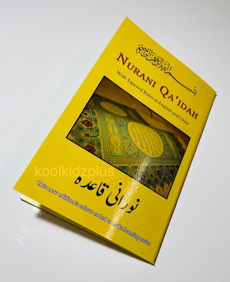 May include: A yellow book titled "Nurani Qa'idah" with Tajweed rules in English and Urdu. The book cover features a colourful image of a mosque interior and the text "نورانی قاعده" in Arabic script. This new edition is colour coded to make learning easier.