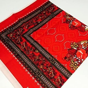 May include: Red bandana with a black and white floral pattern and a white border. The bandana has the text "F.R. ITALY" in the top left corner.
