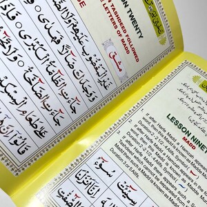 May include: A yellow and white book with the title "Lesson Twenty" and "Lesson Nine" in black text. The book is open to two pages, both of which contain Arabic text and diagrams. The text on the left page is "Exercise on Tashdeed Followed by the Letters of Madd". The text on the right page is "Madd" and "If after Harfe Madd a Hamzah appears in the word, then this Madd is known as Madde Mur. Duration 2-2 1/2-4 Alifs. Symbol ()".