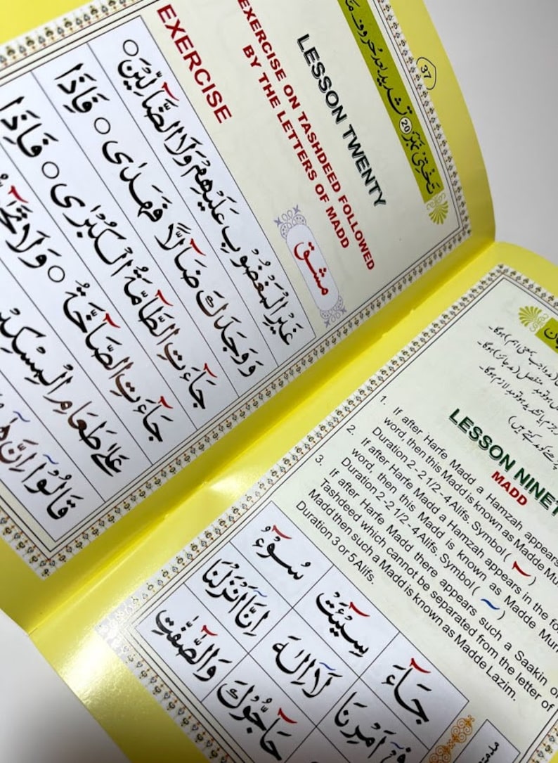 May include: A yellow and white book with the title "Lesson Twenty" and "Lesson Nine" in black text. The book is open to two pages, both of which contain Arabic text and diagrams. The text on the left page is "Exercise on Tashdeed Followed by the Letters of Madd". The text on the right page is "Madd" and "If after Harfe Madd a Hamzah appears in the word, then this Madd is known as Madde Mur. Duration 2-2 1/2-4 Alifs. Symbol ()".
