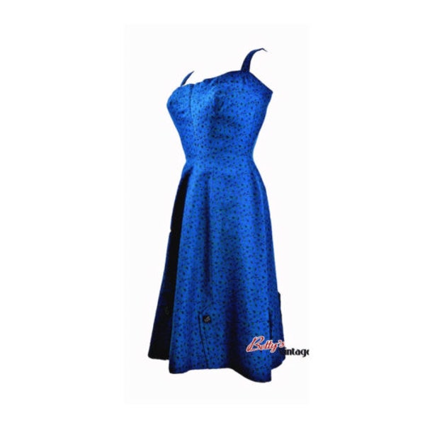 50s vintage electric blue cocktail dress. Thin straps. Fitted at the waist. 50s rockabilly party dress.