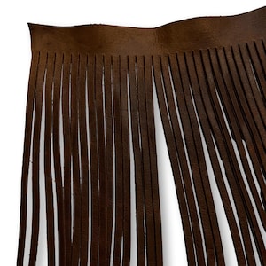May include: Brown leather fringe trim with a straight edge. The fringe is approximately 5 cm long.