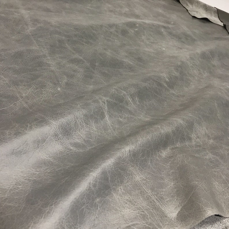 1.1-1.3 mm Distressed Leather 2 skins available Granite Cow Leather with a Waxy Pull Up Finish 3 OZ