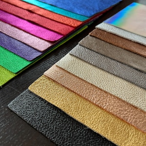 Our Loved Metallic Natural Grain Leathers available in 8.5" by 11" Pre Cut Panels

Black
Gold
Rose Gold
Platinum
Gunmetal
Pewter
Bronze
Silver
Silver Iridescent
Lime Green
Emerald Green
Purple
Pink
Hot Pink
Red
Orange
Turquoise
Royal Blue