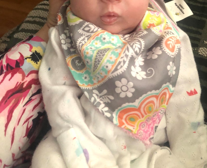 Bandana Bibs are stylish made with cotton fabric that are soft and absorbent.