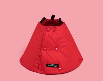 May include: Red padded dog cone with a black strap and the text "million dogs" on the front.
