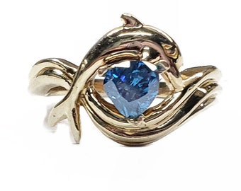 Dolphin Ring, "Independence Day" style setting 80pt. Heart Shape Blue Diamond in 14kt. Gold