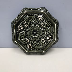 Rare Antique French Dark Green Glazed Ceramic Trivet with detailed design.