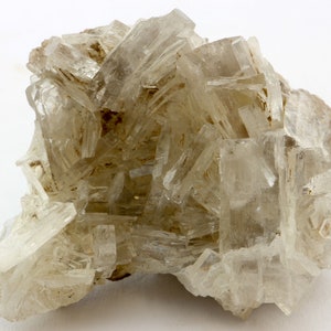 May include: A cluster of clear, translucent crystals with a rough, natural texture. The crystals are arranged in a random, organic pattern, creating a visually interesting and unique piece.