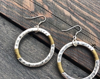 Silver circle w/ gold wire wrap ear wire earrings.