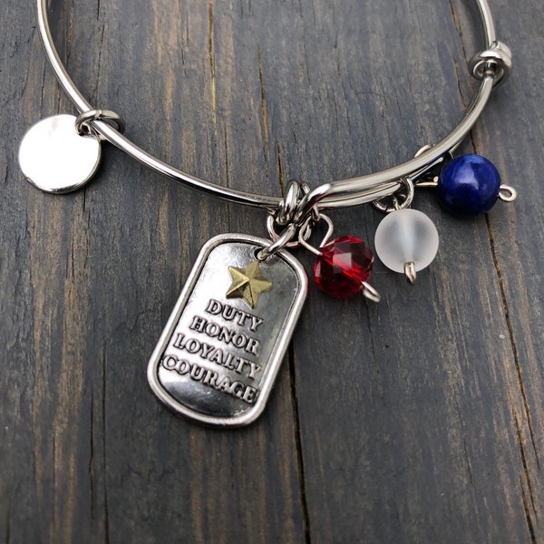 Stainless steel silver bangle bracelet with Duty, Honor, Loyalty, Courage charm, with red, white and blue Fourth of July Inspired theme