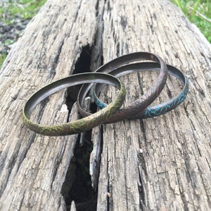 Antique gold metal bracelets with blue, pink and yellow flower etching