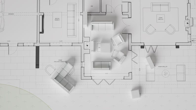 Puede incluir: Un plano blanco con piezas de mobiliario en miniatura colocadas sobre &eacute;l. El plano muestra la planta de una casa con diferentes habitaciones y la colocaci&oacute;n de los muebles.