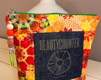 Beautycounter Gorgeous Floral and Repurposed Jean Laser Embossed Cosmetic, Toiletry, Skin Care and Makeup Bag, with Bead Tassel Zipper