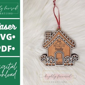 May include: A wooden gingerbread house ornament with the text "The While Family 2020". The ornament has a red and white string for hanging and candy cane accents. The image also includes text that says "Laser SVG PDF digital download".
