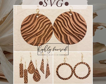 May include: Digital download SVG file for laser cutting zebra print earrings. The set includes a pair of large round earrings, a pair of small round earrings, a pair of teardrop earrings, a pair of rectangular earrings, and a pair of triangle earrings.