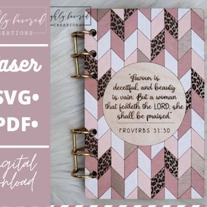 May include: A pink and white wooden notebook with a gold ring binder. The cover features a geometric pattern with a quote from Proverbs 31:30: "Favor is deceitful, and beauty is vain; But a woman that feareth the LORD, she shall be praised."