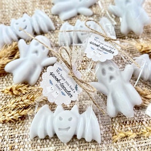 May include: A set of white ghost and bat shaped soaps wrapped in clear cellophane bags with a brown twine bow. Each bag has a small white tag with the text "We hope you had a spook-tacular time!"