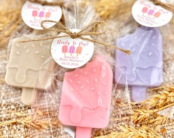 May include: Three small, wrapped popsicle-shaped soaps with a tag that reads "Ready to Pop! Amelia's Baby Shower: 08.31.2024".