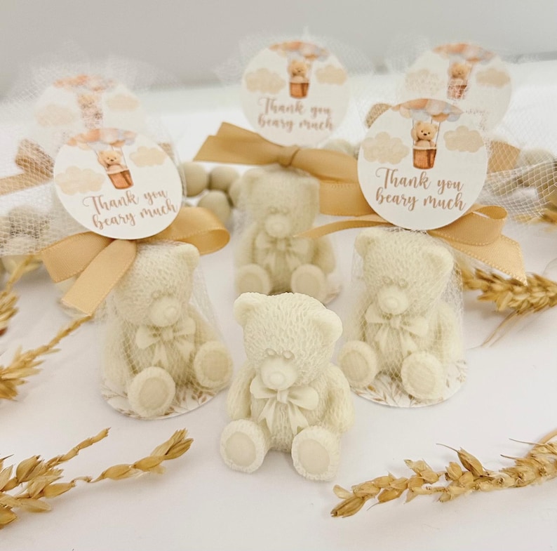 May include: Small white teddy bear favors in clear bags tied with brown ribbon and a tag that says "Thank you beary much".