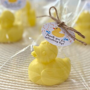 May include: Yellow rubber duck bath toy favor with a thank you tag that reads "Thank you for splashing by!"