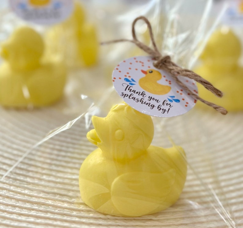 May include: Yellow rubber duck bath toy favor with a thank you tag that reads "Thank you for splashing by!"