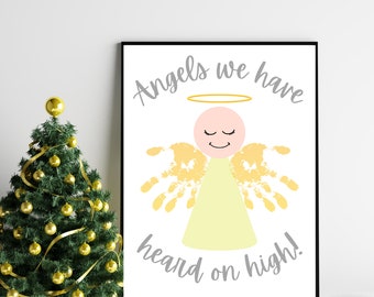 May include: A white printable poster with a handprint angel illustration. The angel has a yellow halo, a light pink head, and yellow handprints for wings. The text reads "Angels we have heard on high!"